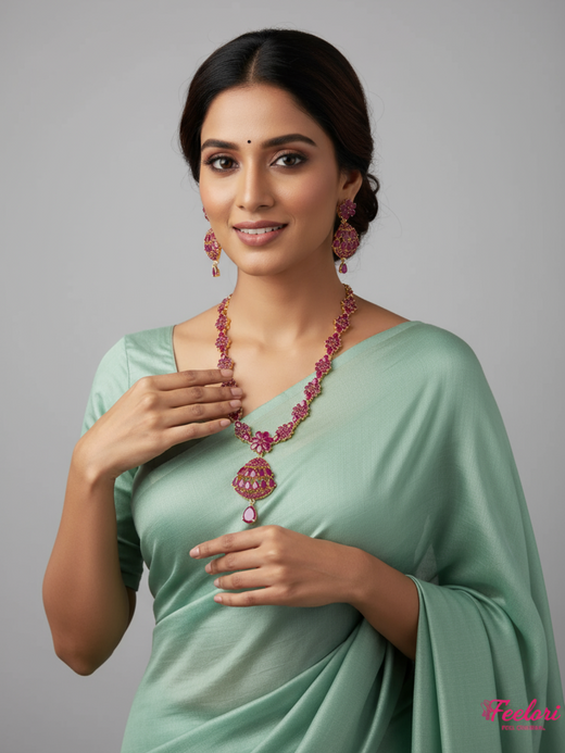 FeelOri Gold Plated Ruby Necklace Set - Model wearing elegant set with light green saree, smiling