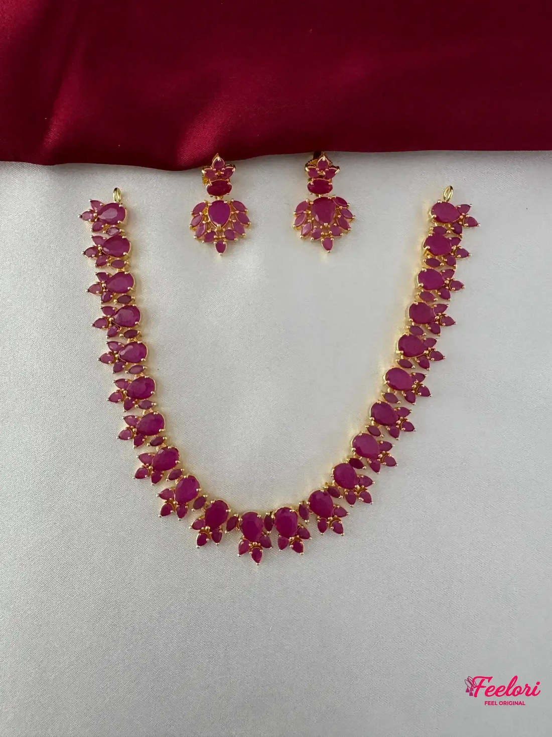 FeelOri Gold Plated Ruby Petal Necklace Set - Front view showing the complete ensemble with necklace and matching drop earrings.