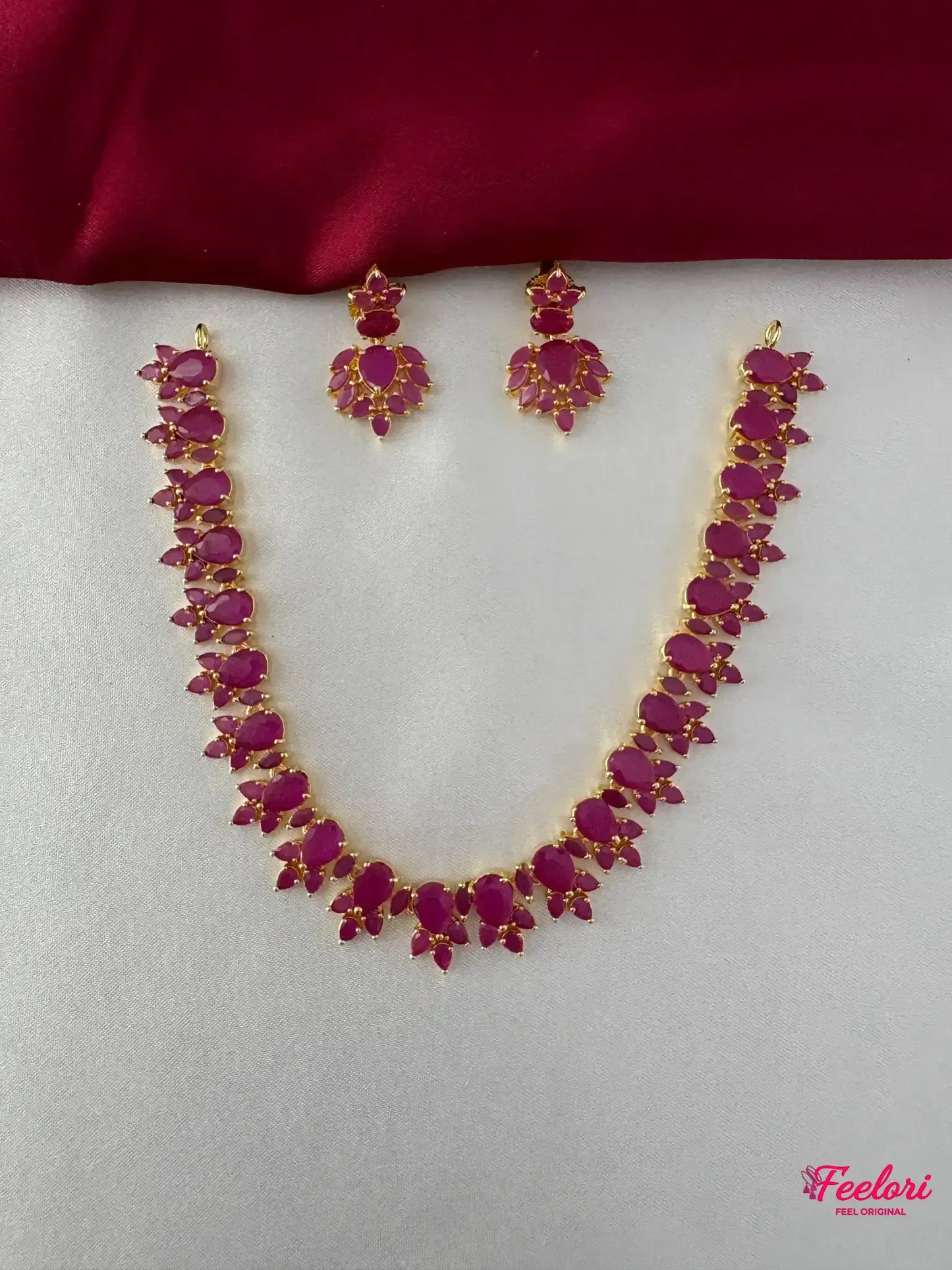 FeelOri Gold Plated Ruby Petal Necklace Set - Front view showing the complete ensemble with necklace and matching drop earrings.