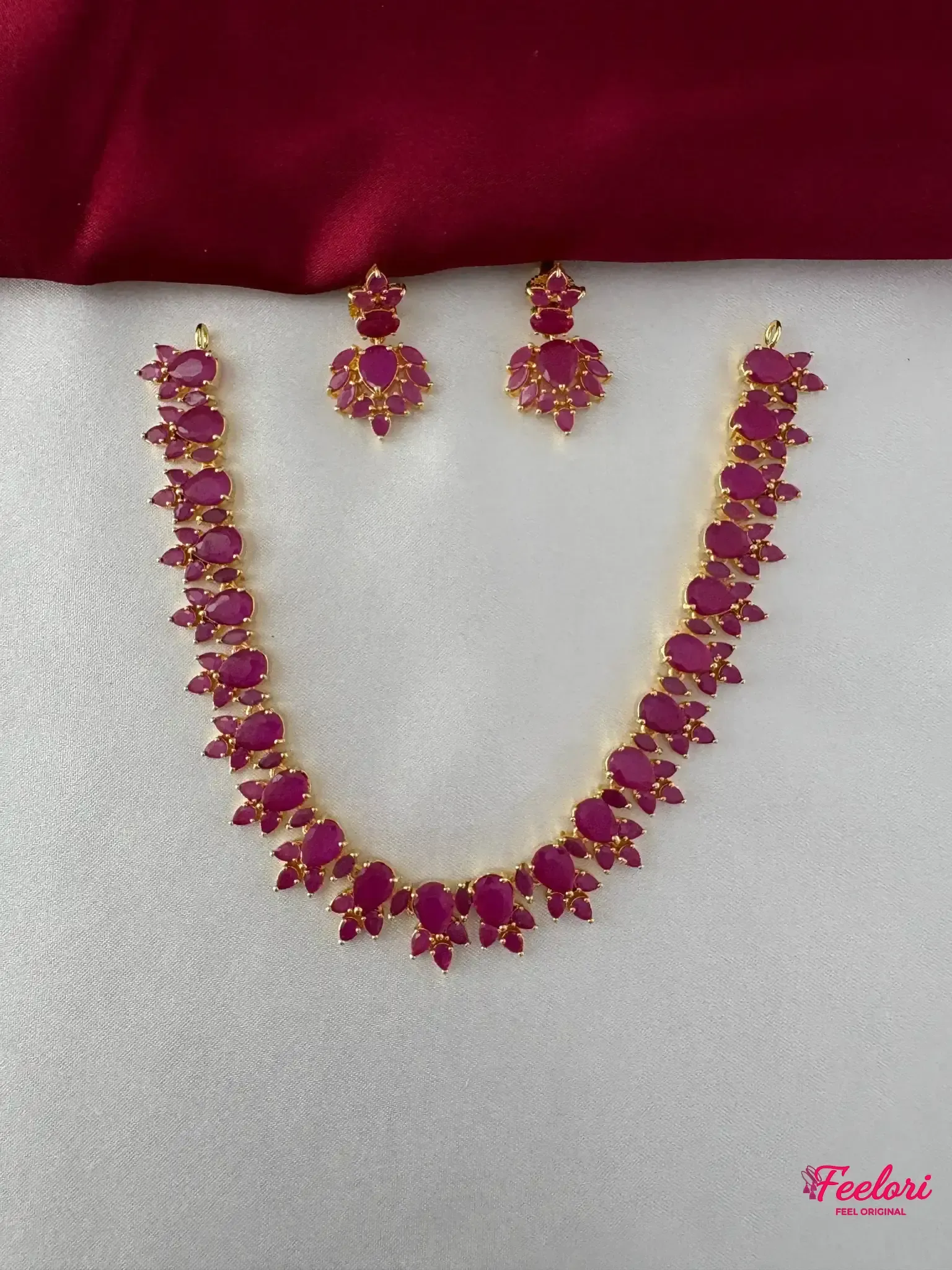FeelOri Gold Plated Ruby Petal Necklace Set - Front view showing the complete ensemble with necklace and matching drop earrings.