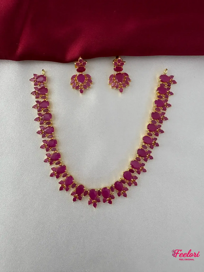 FeelOri Gold Plated Ruby Petal Necklace Set - Front view showing the complete ensemble with necklace and matching drop earrings.