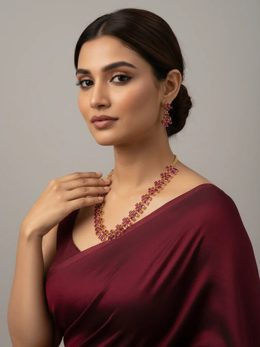 FeelOri Gold Plated Ruby Necklace Set - Model in beautiful maroon saree showcasing cluster ruby set.