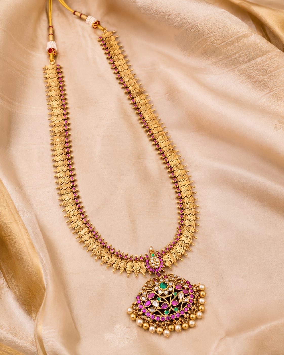 FeelOri gold-polished long haram necklace styled with saree fabric for Indian occasion wear