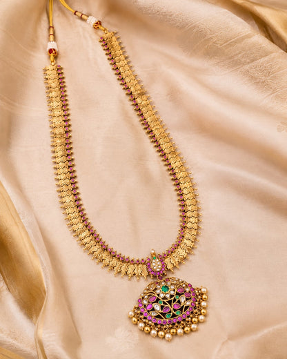FeelOri gold-polished long haram necklace styled with saree fabric for Indian occasion wear