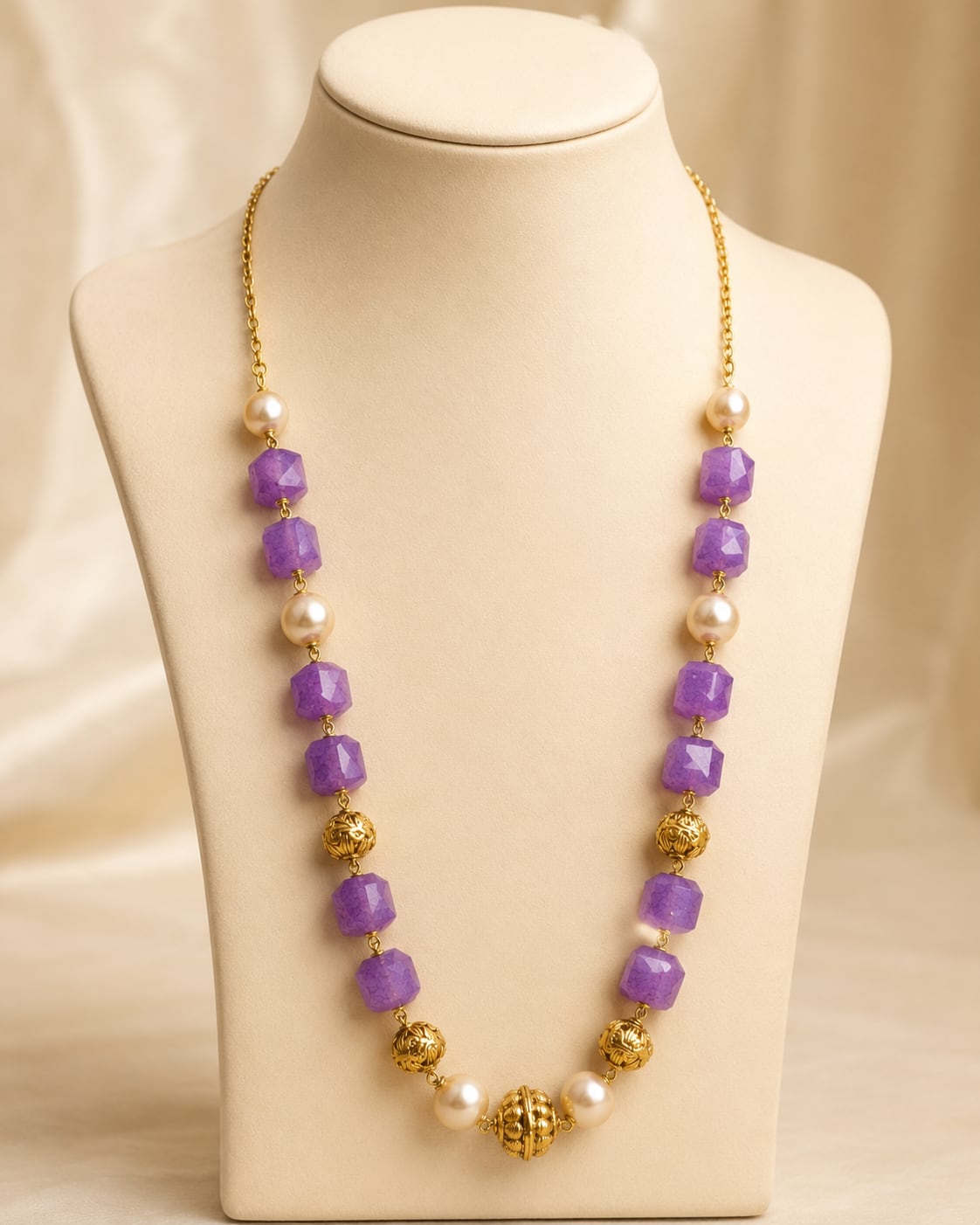 FeelOri gold-polished necklace on jewellery display