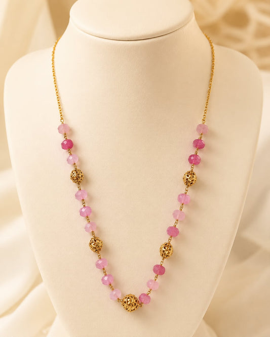 FeelOri pink faceted bead and filigree 18-inch necklace on an ivory display