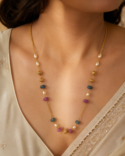 FeelOri gold-polished necklace styled with Indian occasion wear
