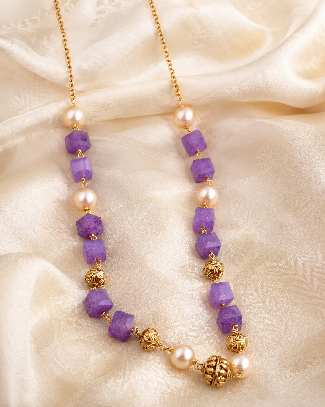 FeelOri gold-polished necklace styled with saree fabric for Indian occasion wear