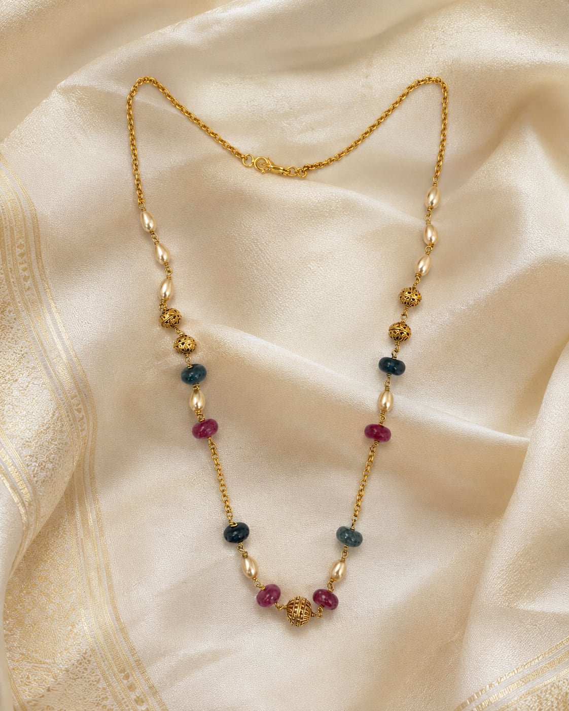 FeelOri gold-polished necklace styled with saree fabric for Indian occasion wear