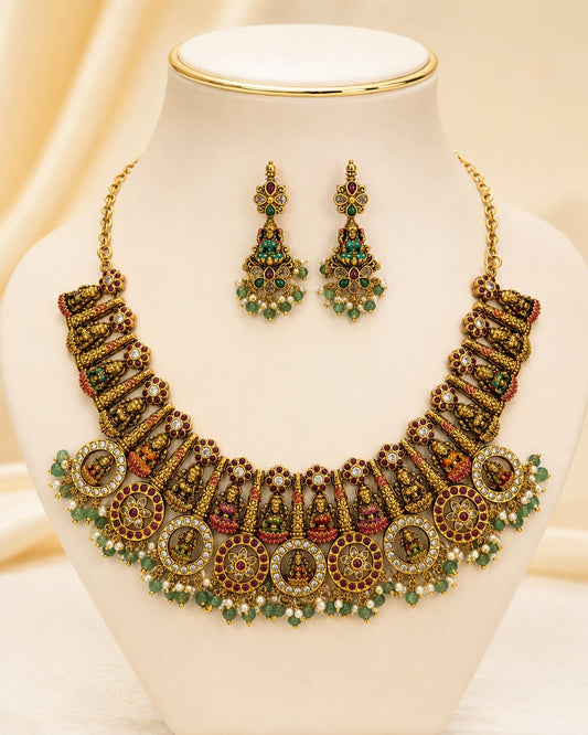 FeelOri gold-polished necklace set with matching earrings on jewellery display
