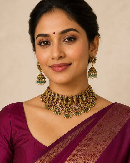 FeelOri gold-polished necklace set with matching earrings on jewellery display