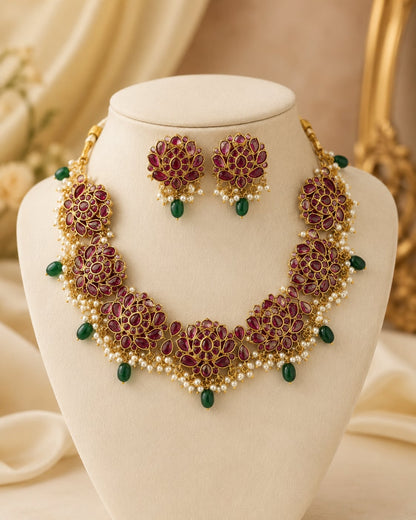 FeelOri gold-polished necklace set with matching earrings on jewellery display