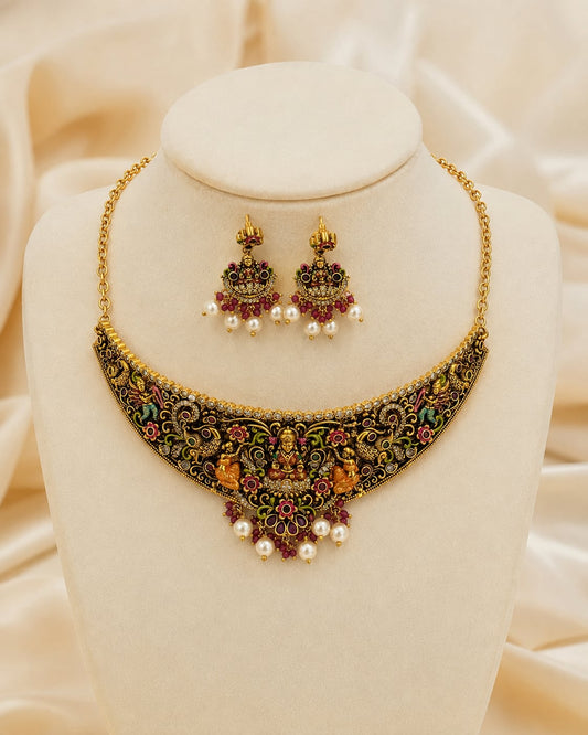FeelOri gold-polished necklace set with matching earrings on jewellery display