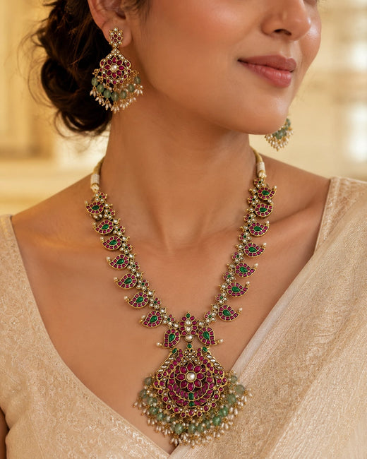 FeelOri gold-polished necklace set with matching earrings styled with Indian occasion wear