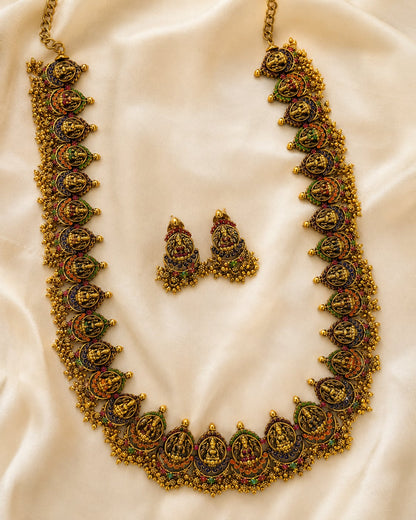 FeelOri gold-polished necklace set with matching earrings styled with saree fabric for Indian occasion wear