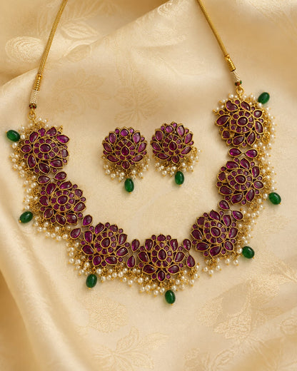 FeelOri gold-polished necklace set with matching earrings styled with saree fabric for Indian occasion wear