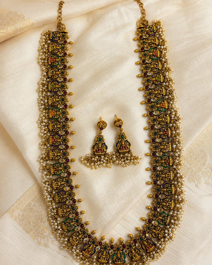 FeelOri gold-polished necklace set with matching earrings styled with saree fabric for Indian occasion wear