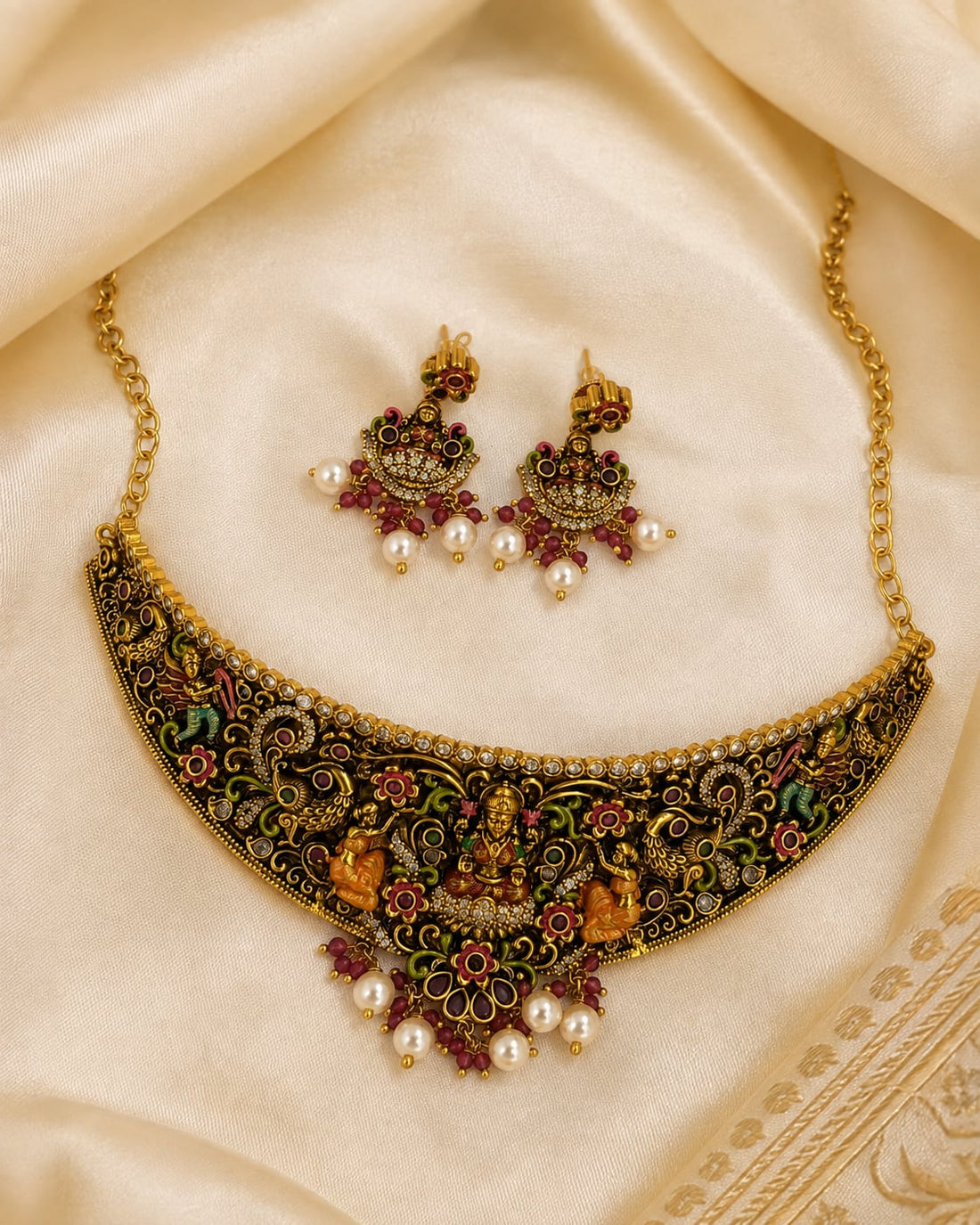 FeelOri gold-polished necklace set with matching earrings styled with saree fabric for Indian occasion wear