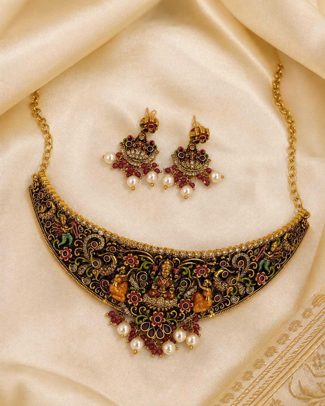 FeelOri gold-polished necklace set with matching earrings styled with saree fabric for Indian occasion wear