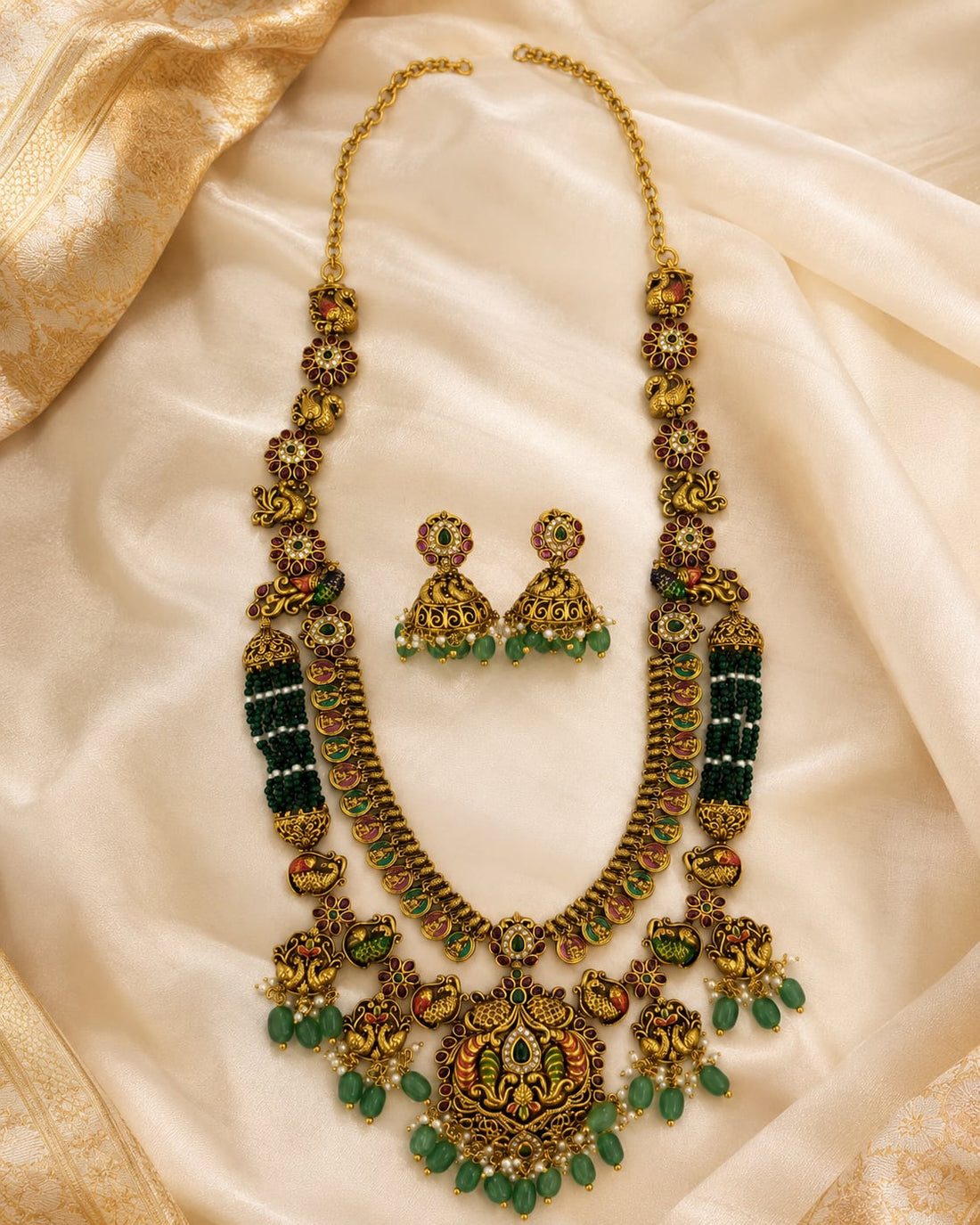 FeelOri gold-polished necklace set with matching earrings styled with saree fabric for Indian occasion wear