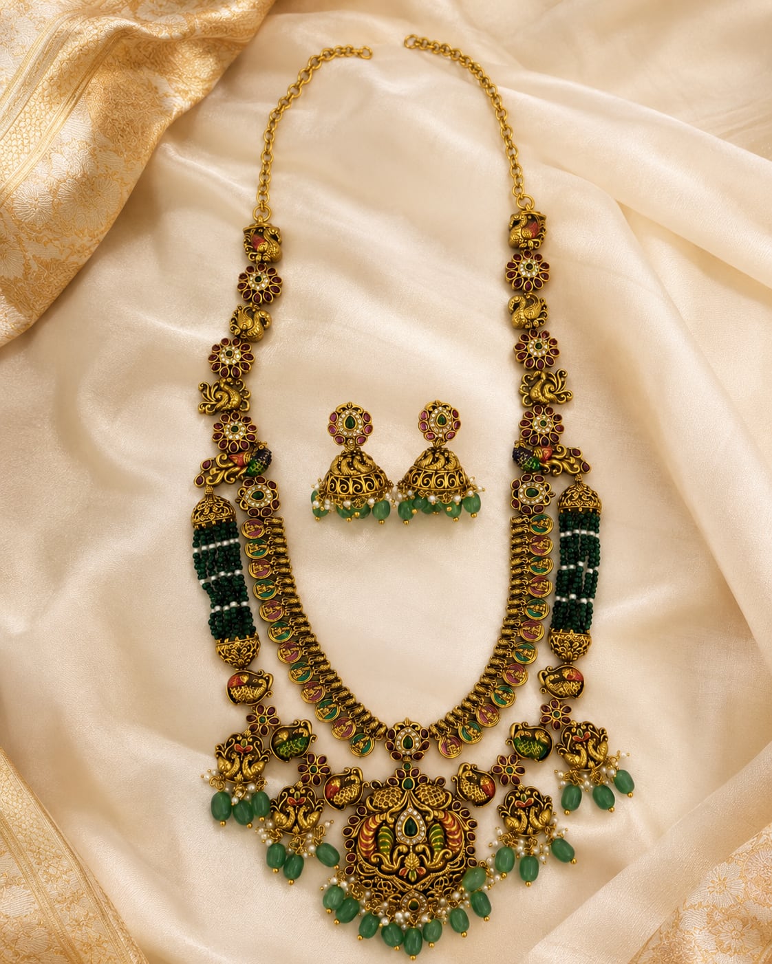 FeelOri gold-polished necklace set with matching earrings styled with saree fabric for Indian occasion wear