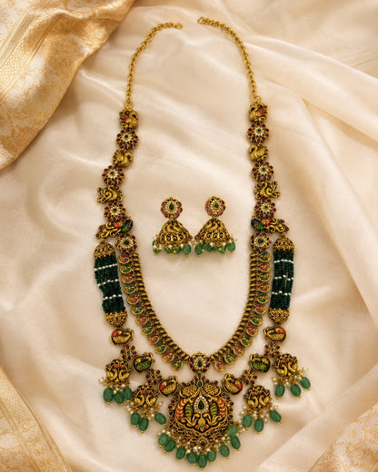 FeelOri gold-polished necklace set with matching earrings styled with saree fabric for Indian occasion wear