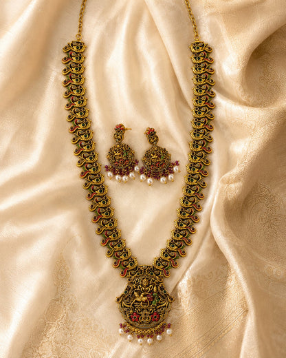 FeelOri gold-polished necklace set with matching earrings styled with saree fabric for Indian occasion wear
