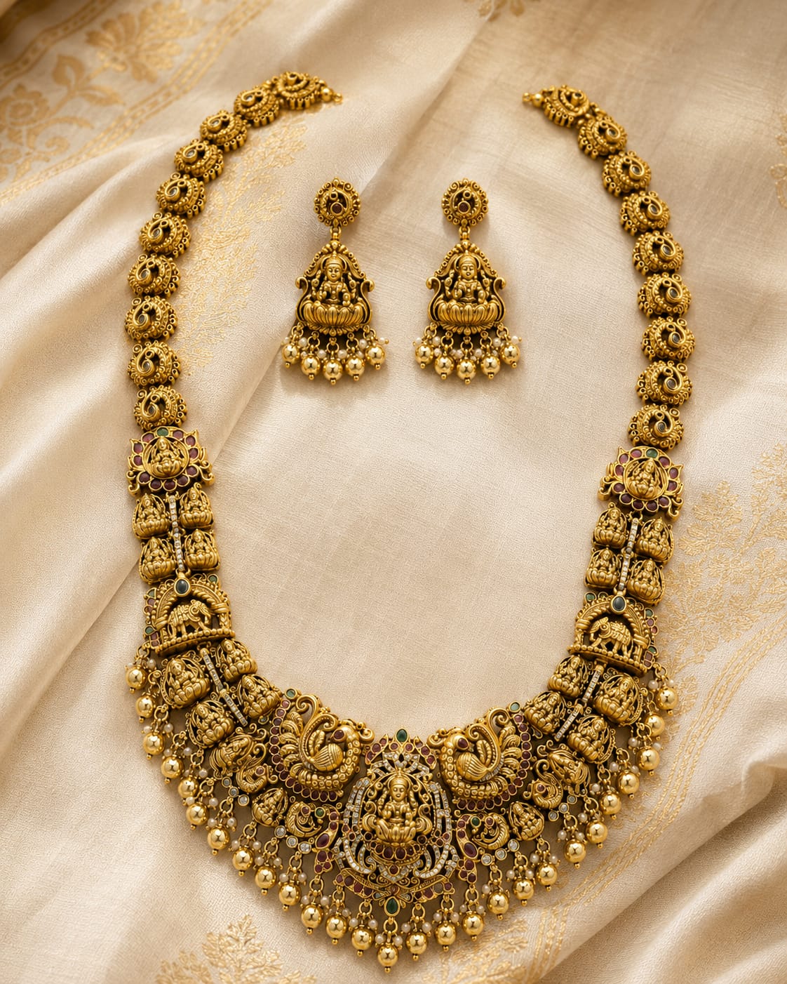 FeelOri gold-polished necklace set with matching earrings styled with saree fabric for Indian occasion wear