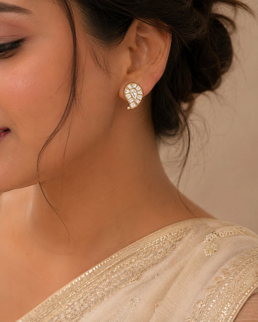 FeelOri gold-polished stud earrings styled with Indian occasion wear