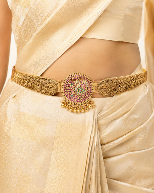 FeelOri gold-polished vaddanam waist belt styled with Indian occasion wear