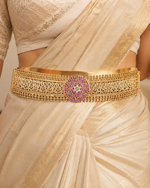 FeelOri gold-polished vaddanam waist belt styled with Indian occasion wear
