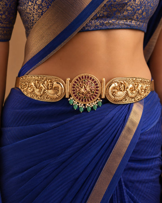 FeelOri gold-polished vaddanam waist belt styled with Indian occasion wear