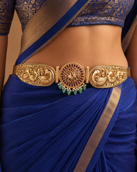 FeelOri gold-polished vaddanam waist belt styled with Indian occasion wear