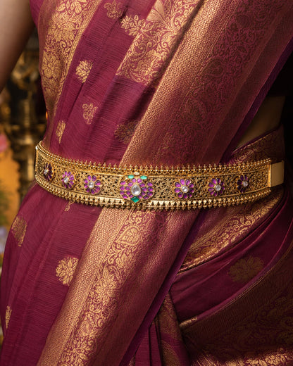 FeelOri gold-polished vaddanam waist belt styled with Indian occasion wear