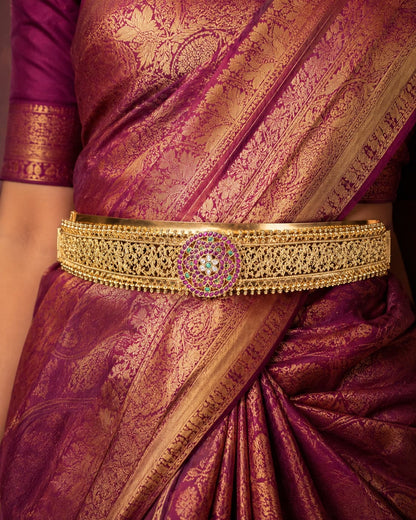 FeelOri gold-polished vaddanam waist belt styled with saree fabric for Indian occasion wear