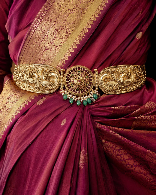 FeelOri gold-polished vaddanam waist belt styled with saree fabric for Indian occasion wear