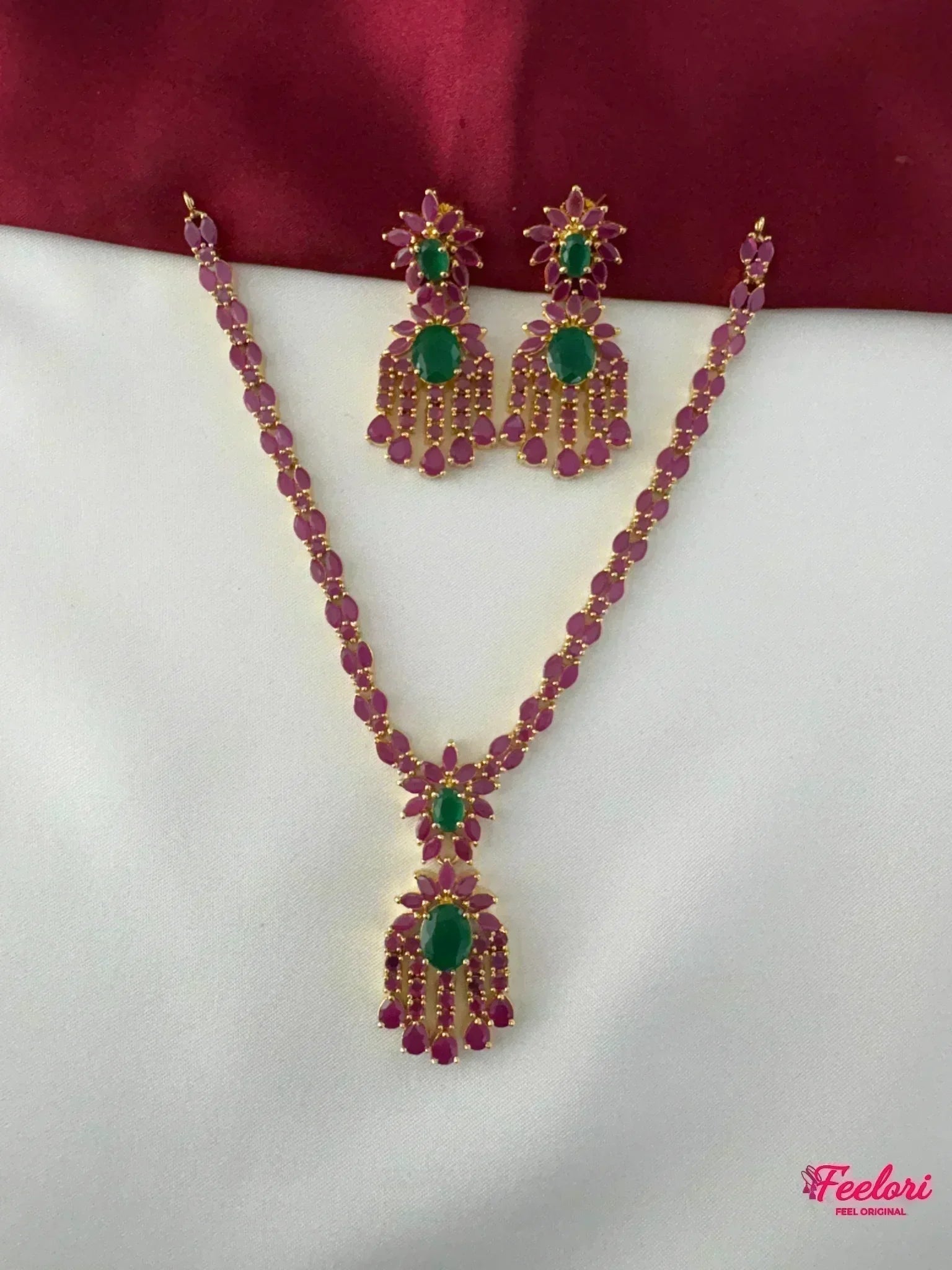 FeelOri Gold Plated Ruby Emerald Petal Drop Necklace Set - Full view of the necklace and matching earrings showcasing intricate stone arrangement.