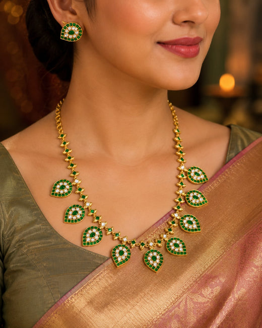 FeelOri green leaf motif jadau kundan necklace set with matching earrings on jewellery display