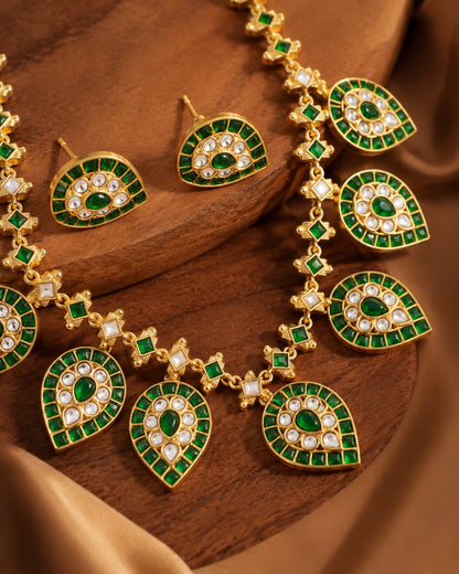 FeelOri green leaf motif jadau kundan necklace set with matching earrings styled with saree fabric