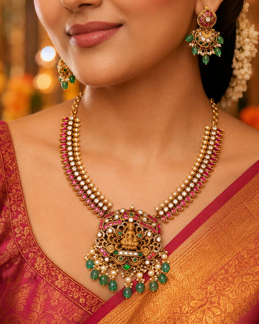 FeelOri lakshmi motif temple-style necklace set listed as necklace set with matching earrings on jewellery display