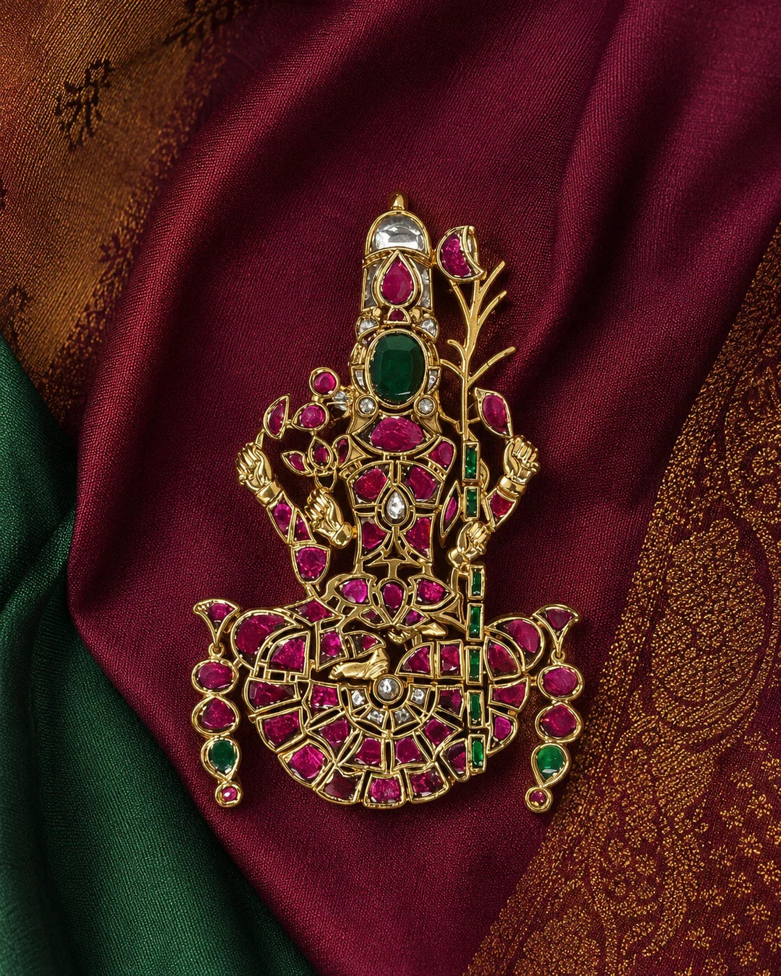 Lalitha Tripurasundari Jadau Kundan temple pendant styled on maroon and green silk fabric