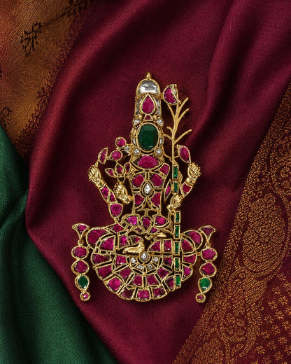 Lalitha Tripurasundari Jadau Kundan temple pendant styled on maroon and green silk fabric