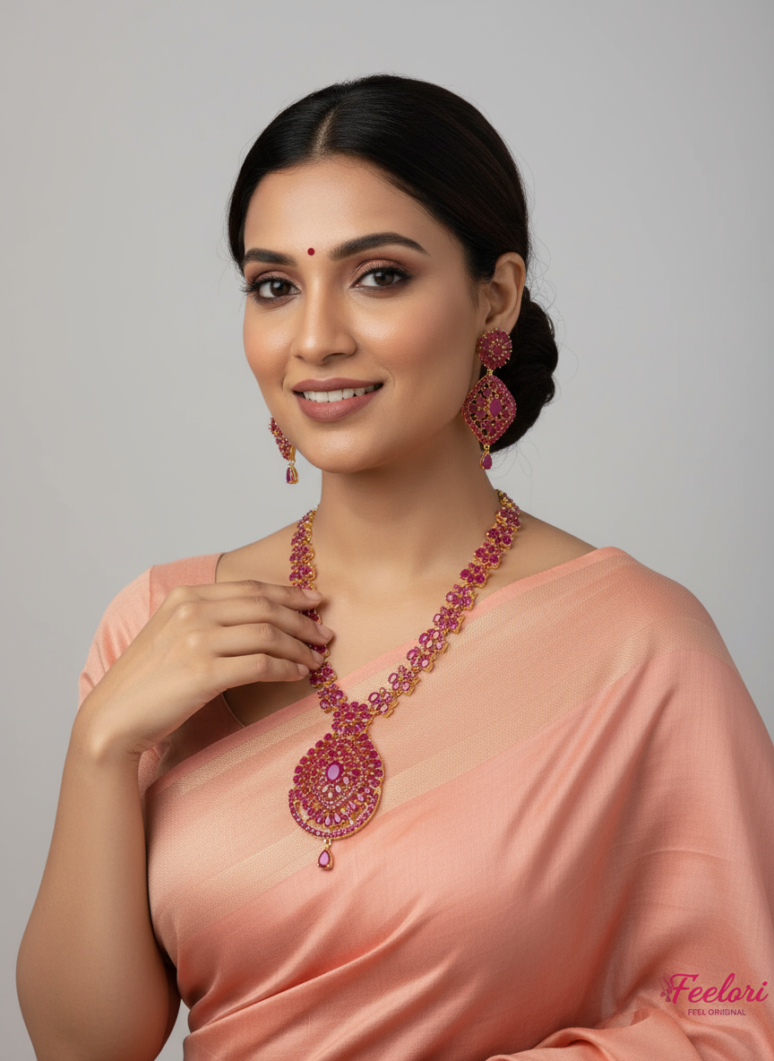 FeelOri Gold Plated Ruby Necklace Set - Model wearing elegant set with traditional saree against plain backdrop.