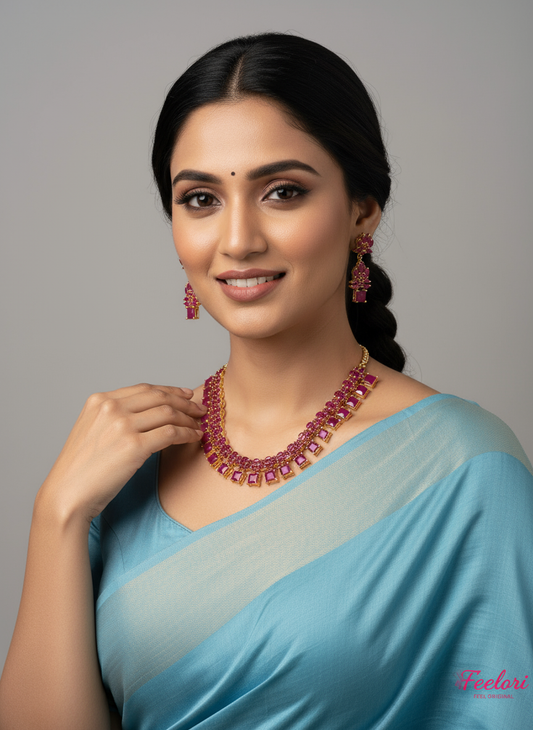 FeelOri Gold Plated Ruby Necklace Set - Model wearing elegant set with light blue saree.