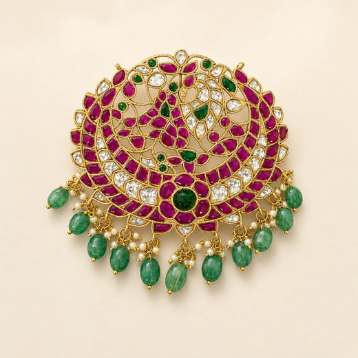 Front view of FeelOri Manga Chandbali Jadau Kundan peacock pendant with ruby-coloured, white and green details
