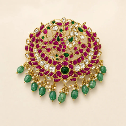 Front view of FeelOri Manga Chandbali Jadau Kundan peacock pendant with ruby-coloured, white and green details