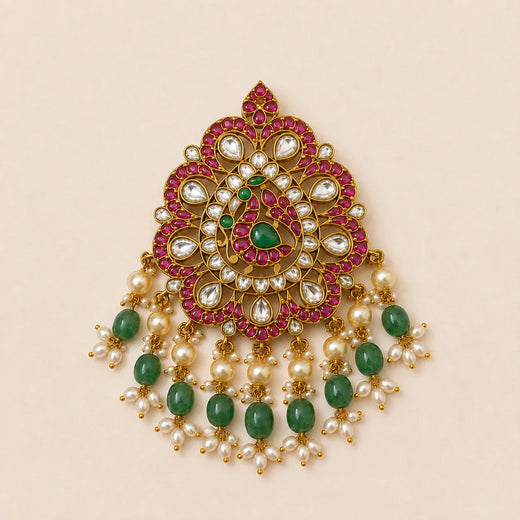 Front view of FeelOri Mayur Mandala Jadau Kundan peacock pendant with ruby-coloured, white and green stone details