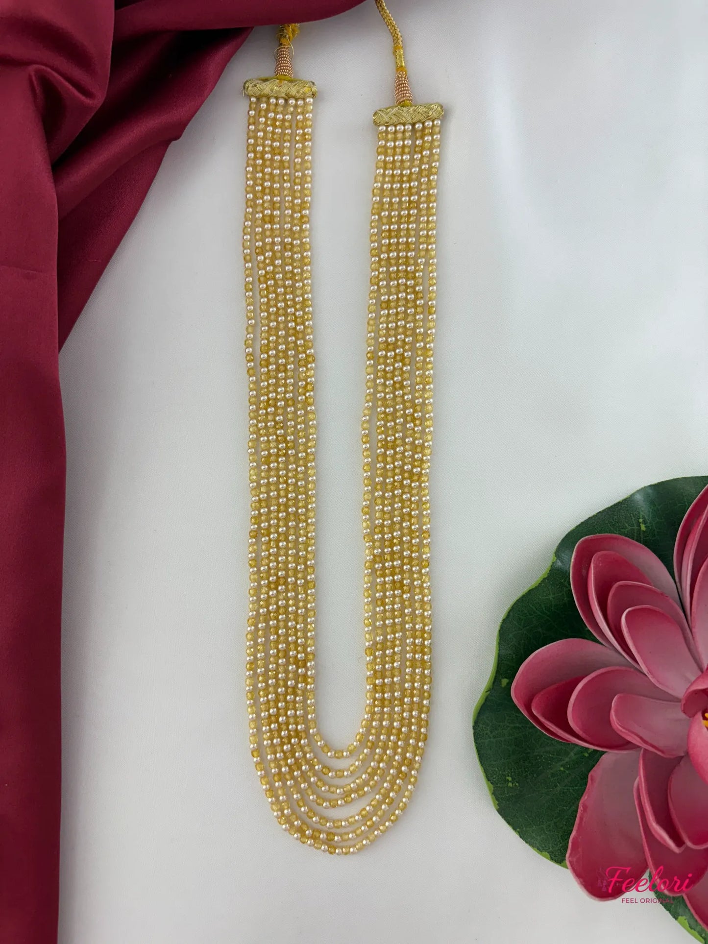 FeelOri Mother of Pearls & CZ Seven-Strand Necklace - Full length display highlighting the uniform pearl arrangement and elegant drape from a straight angle.