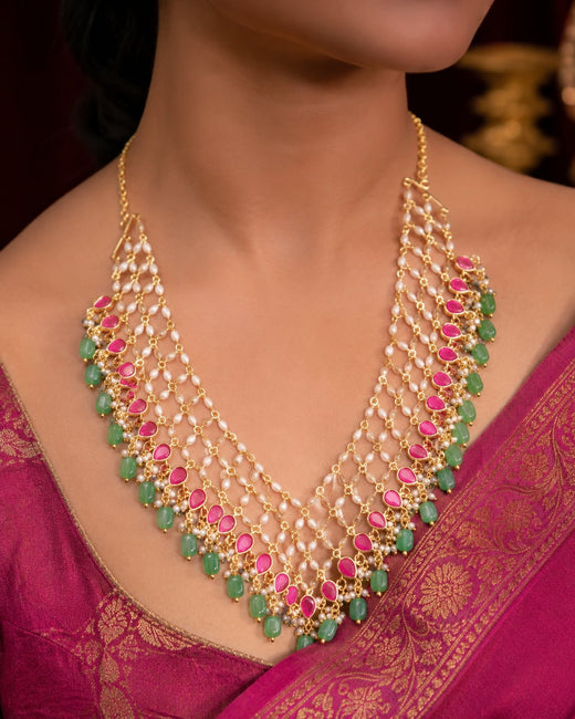 FeelOri net panel green drop jadau kundan necklace set with matching earrings on jewellery display
