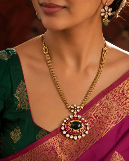 FeelOri oval pendant jadau kundan necklace set with matching earrings on jewellery display